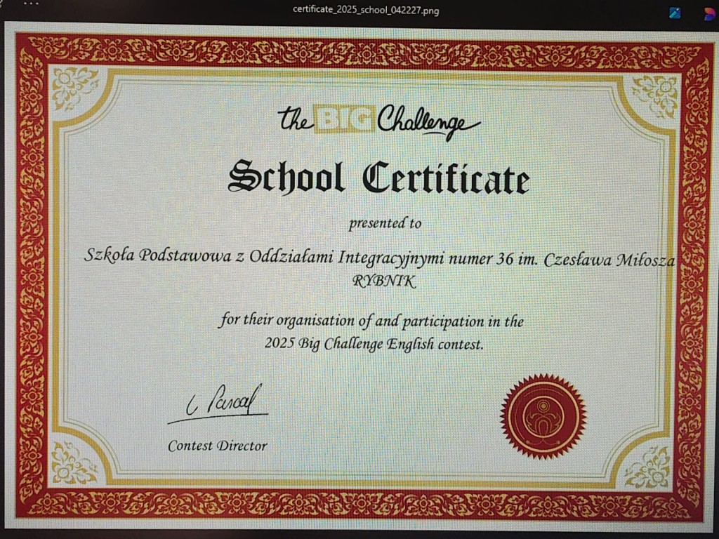 Konkurs The Big Challenge 2025. Slajd przedstawia certyfikat, jaki otrzymała szkoła za przeprowadzenie konkursu.